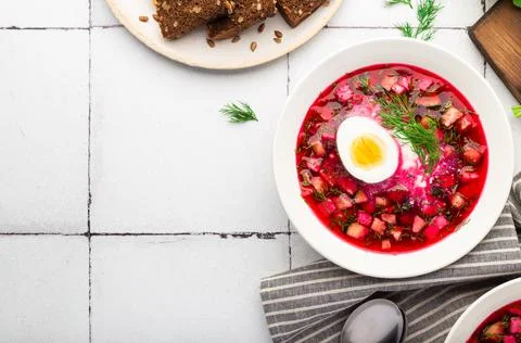 Summer cold beetroot soup with sour cream and egg Stock Photos