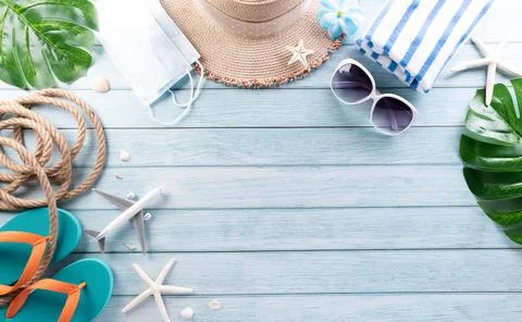 Summer composition concept made from starfish, beach hat, flip flop, airplane Stock Photos