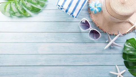 Summer composition concept made from starfish, beach hat, flip flop, airplane Stock Photos