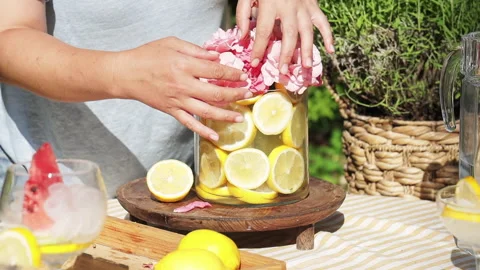 Summer composition in a glass vase with lemons and garden roses Stock Footage 278962731