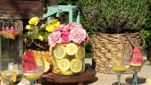 Summer composition in a glass vase with lemons and garden roses Video stock 278962748