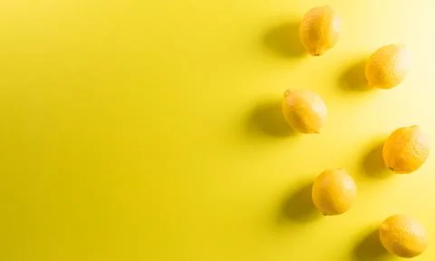 Summer composition made from lemon or lime on pastel yellow background. Fruit Stock Photos