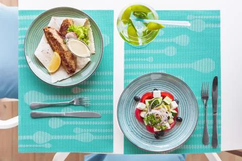 Summer composition on the summer playground table and chairs . On the table Stock Photos