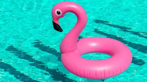 Summer concept background. Pink inflatable flamingo in pool water for summer  Stock Photos