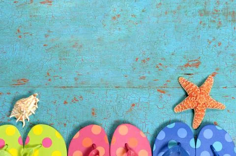 Summer Concept with Flip-flops Over Grunge Table Stock Photos