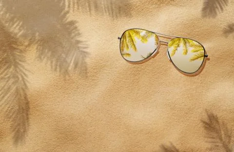 Summer concept, high angle view of sunglasses in the sand Stock Photos