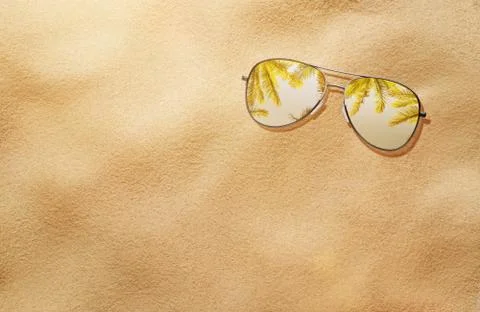 Summer concept, high angle view of sunglasses in the sand Stock Photos