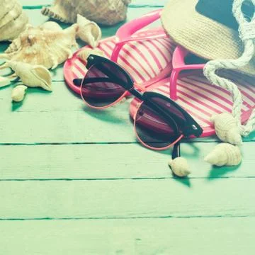 Summer concept with sandy beach, shells and cord. Stock Photos