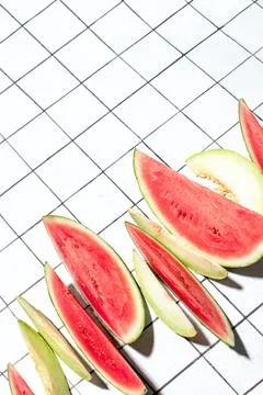Summer concept with sliced melon and watermelon pieces put in a raw Stock Photos