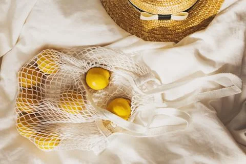 Summer creative flat lay composition with lemon and straw hat Foto stock