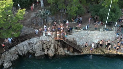 Summer Crowd and People Diving into Blue Sea - Akyaka Turkey 16 Aug 2023 Stock Footage 329378679