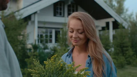 Summer date of happy couple at front yard of rural house. Family spending romant Video stock 199482419