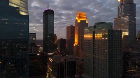 Summer dawn casts warm light over Minneapolis’ downtown skyline from above. Stock Footage 324949437