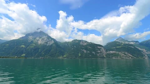 Summer day on a background of mountains in the lake. Stock Footage 65210450