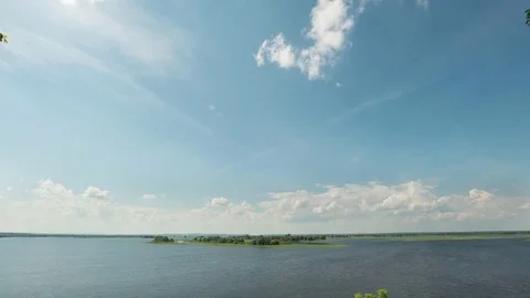 Summer day river and clouds over water, time-lapse 動画素材 77636315