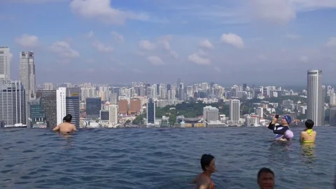 Summer day singapore famous hotel rooftop crowded pool cityscape panorama 4k Stock Footage