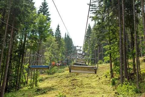 Summer day view of ski elevator in mountains Stock Photos