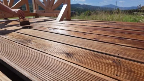 Summer Deck Impregnate Maintenance with Scenic View - DIY Stock Footage 318347549