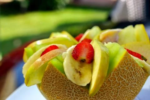 Summer dessert  melon strawberries pears banana Stock Photos
