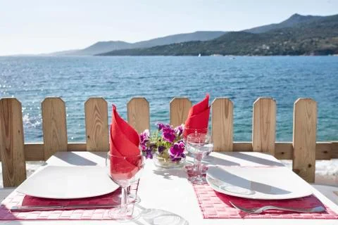 Summer dinner on the sea Stock Photos