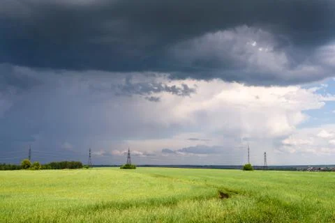 Summer Dramatic Scene: Coming Heavy Thunderstorm over Meadow Stock Photos