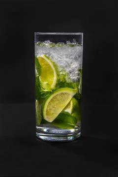 Summer drink with lime and mint isolated black Stock Photos