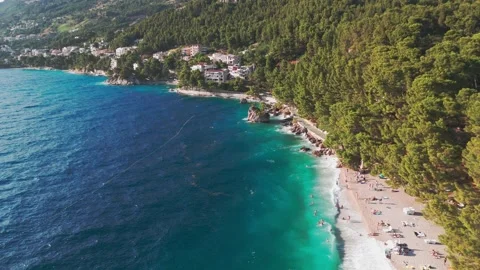 Summer Drone View of Punta Rata Beach and Brela Stone Amid Bura Winds Stock Footage 313680120