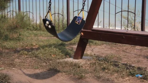 Summer an empty swing swings Stock Footage 87597523