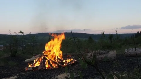 Summer evening - Bonfire and sunset Stock Footage 75316012