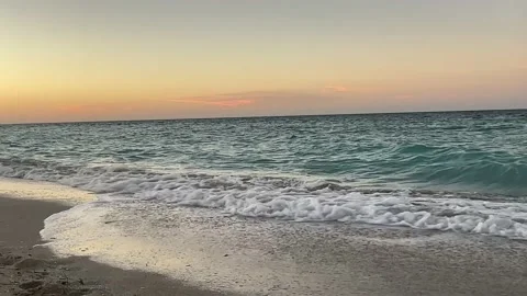 Summer evening on the Cuban beach against the backdrop of the sea sunset.  Stock Footage 231003006