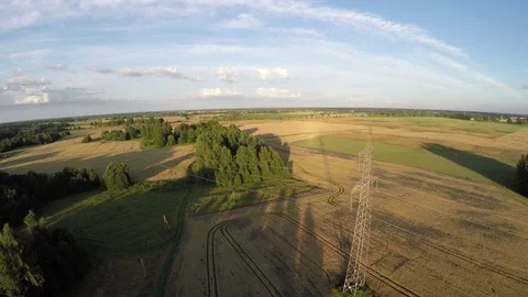 Summer evening landscape with  fields and electrical tower  from flying drone 스톡 동영상 78414591