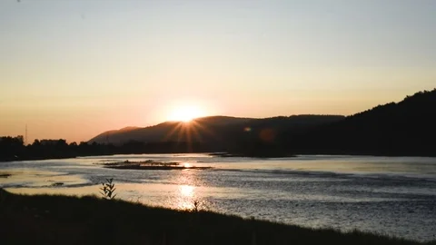 Summer evening on the river with the rays of the setting sun Stock Footage 119801797