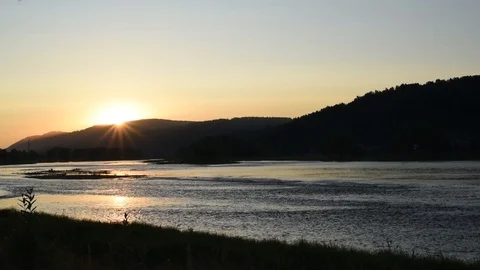 Summer evening on the river with the rays of the setting sun Stock Footage 119801798