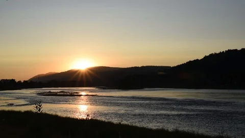 Summer evening on the river with the rays of the setting sun Stock Footage 119802027