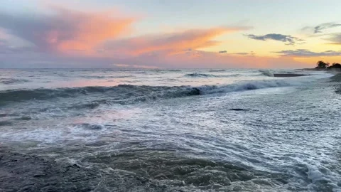 Summer evening seascape. Incoming warm wave on the shore of pebbles Stock Footage 220791653