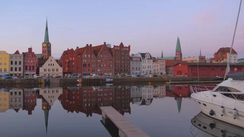 Summer evening view of the Old Town pier architecture in Lubeck, Germany Stock Footage 78058063