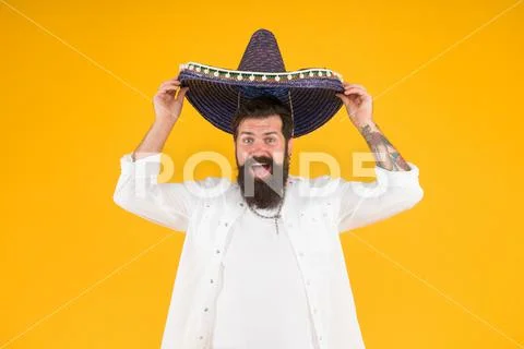 Summer festival. National holidays. Mexican hat sombrero. Guy happy festive Stock Photos