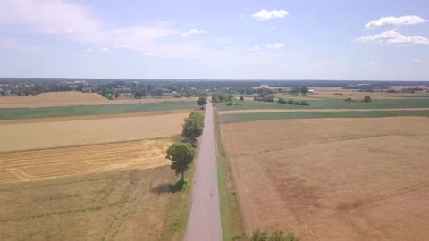 Summer fields and asphalt road in Poland. Drone footage. Stock Footage 248631960