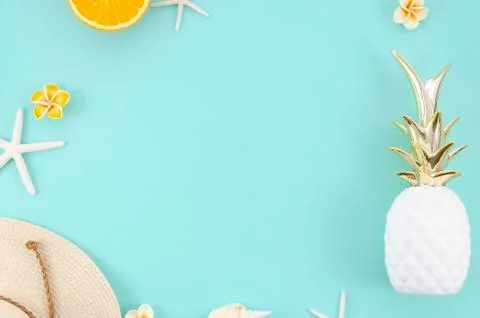 Summer flat lay frame with oranges, hat and pineapple. Top view Stock Photos