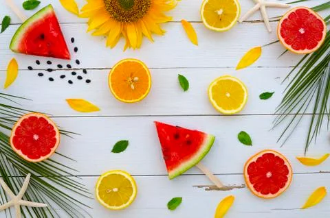 Summer flatlay background. Bright citrus composition from watermelon, grapefruit Stock Photos