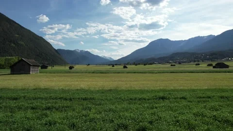 Summer flight above grassfields in Austria Stockbeeldmateriaal 156043032