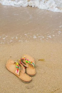 Summer flip flops on the beach Stock Photos