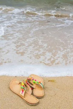 Summer flip flops on the beach Stock Photos