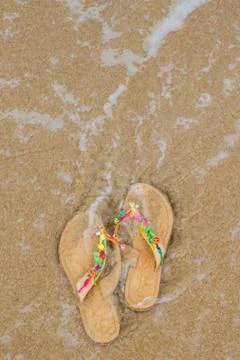 Summer flip flops on the beach Stock Photos