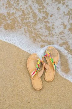 Summer flip flops on the beach Stock Photos
