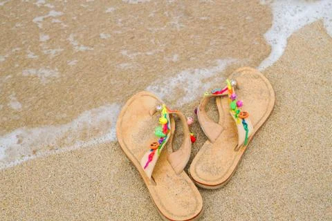 Summer flip flops on the beach Stock Photos