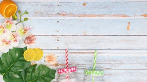 Summer fresh beach decorations appear on blue wooden background - Stop motion Stock Footage 128285701