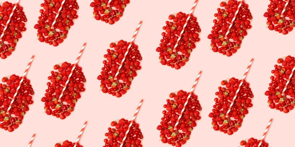Summer fruit concept pattern. Red ripe berries in the shape of a glass with f Stock Photos