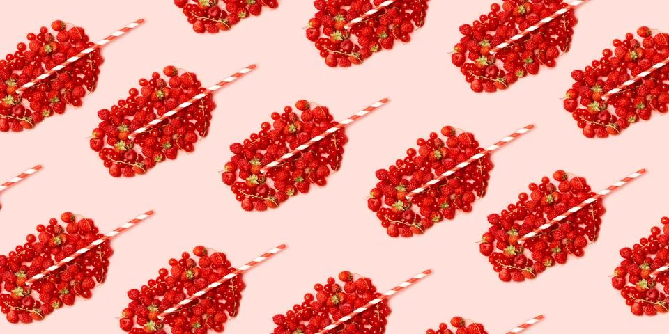 Summer fruit concept pattern. Red ripe berries in the shape of a glass with f Stock Photos