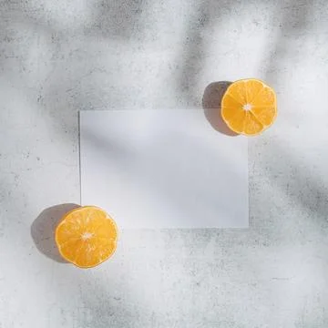 Summer fruit flat lay created with copy space paper and lemon slices in the p Stock Photos